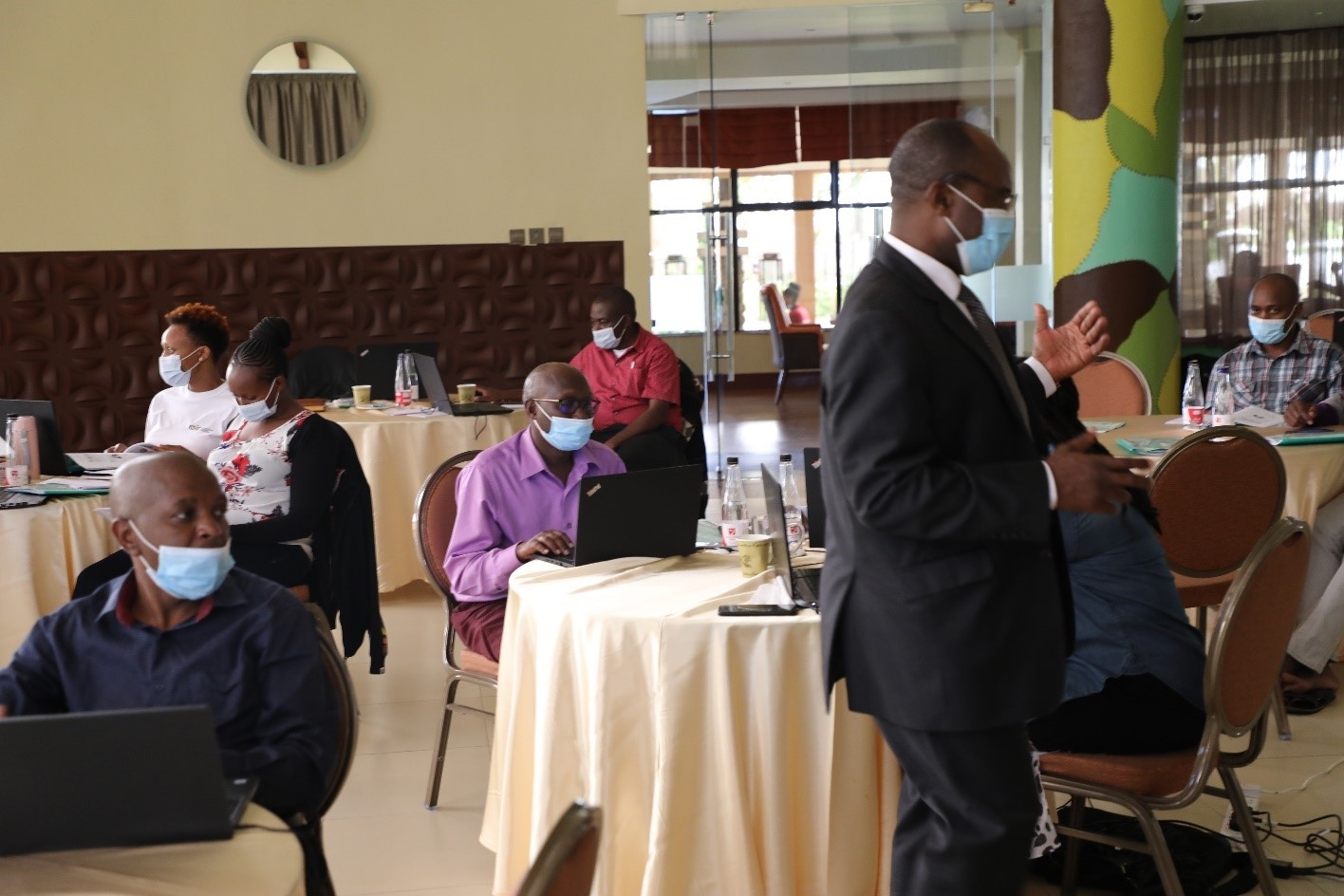 As a section of staff listen to a consultant during a previous staff sensitization on the Performance Management and Balance Scorecard
