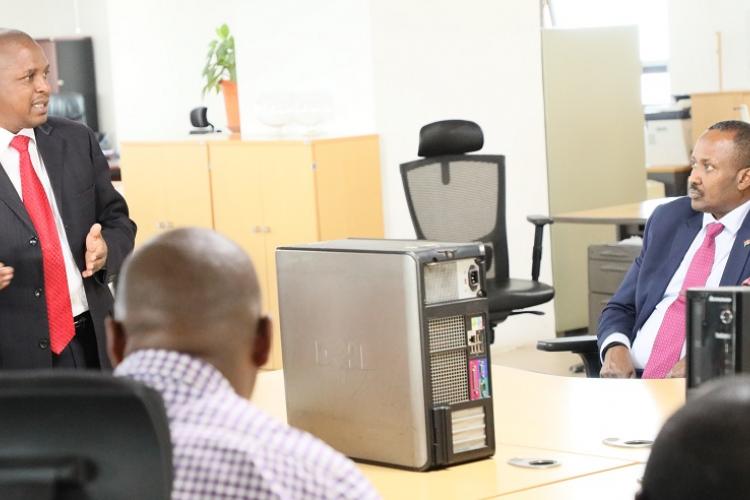 We are in this together....Dr. Kitonyo of Resolution makes his contribution during the forum as the CEO listens keenly.